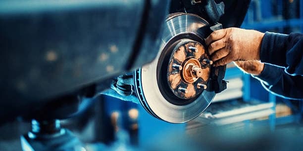 Front and Back Brake-Pad Replacement and a Brake Fluid Flush ( No European or Sports Cars)